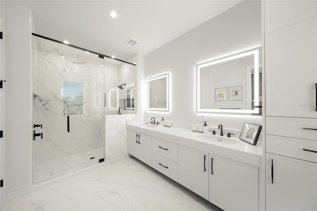 bathroom with vanity and a shower with shower door