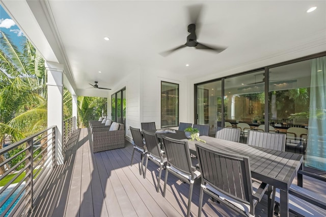 wooden deck featuring ceiling fan