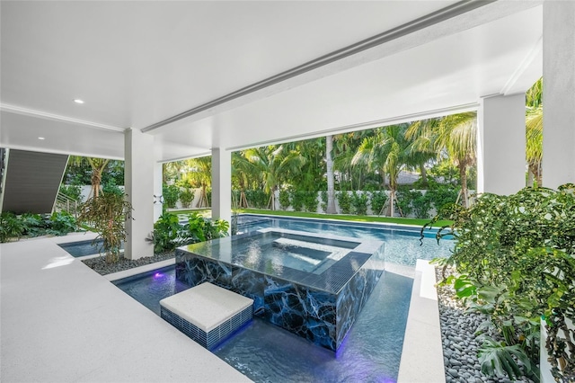 view of swimming pool featuring an in ground hot tub and pool water feature