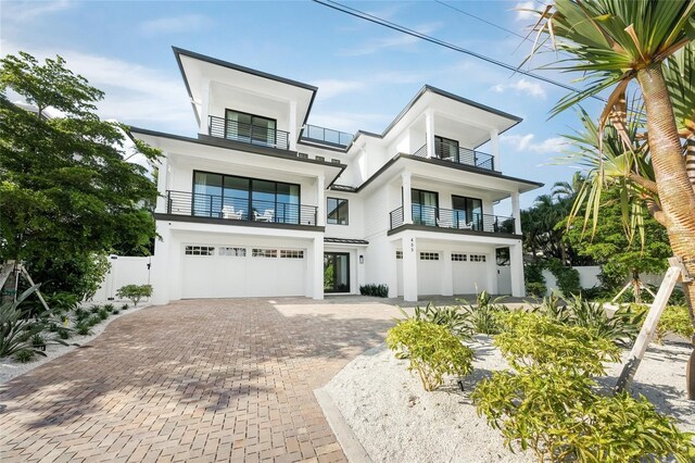 contemporary house featuring a balcony and a garage