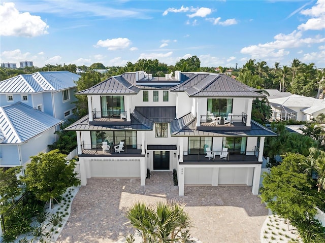 view of front of house with a garage and a balcony