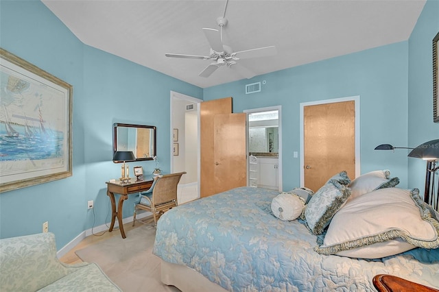 bedroom featuring ceiling fan and ensuite bathroom