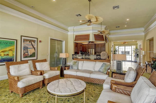 living room featuring ceiling fan and ornamental molding