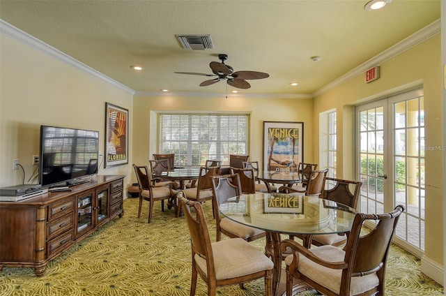 dining space with ceiling fan, crown molding, french doors, and a wealth of natural light