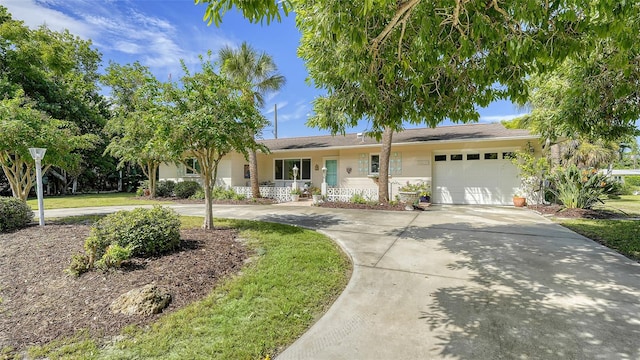 view of front of property with covered porch and a garage