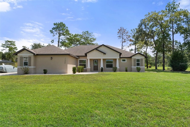 ranch-style home featuring a front yard