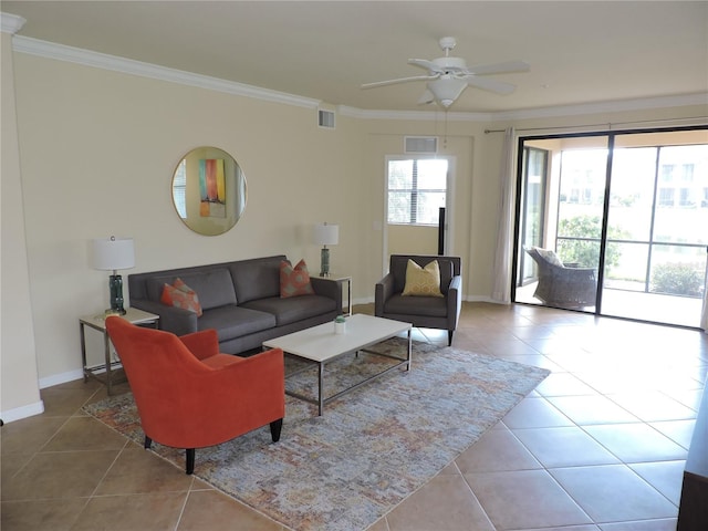 tiled living room with ceiling fan and crown molding