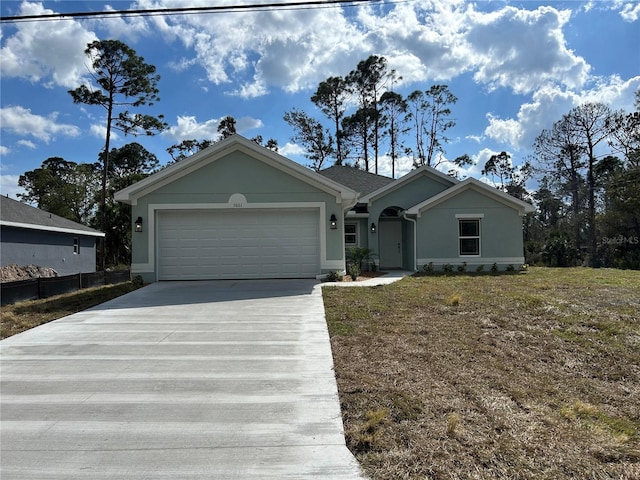 single story home featuring a garage and a front yard