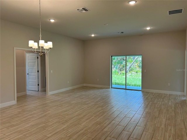 5661 Gaffney Rd, North Port, FL 34286 - unfurnished room with a chandelier, light wood-type flooring, and recessed lighting