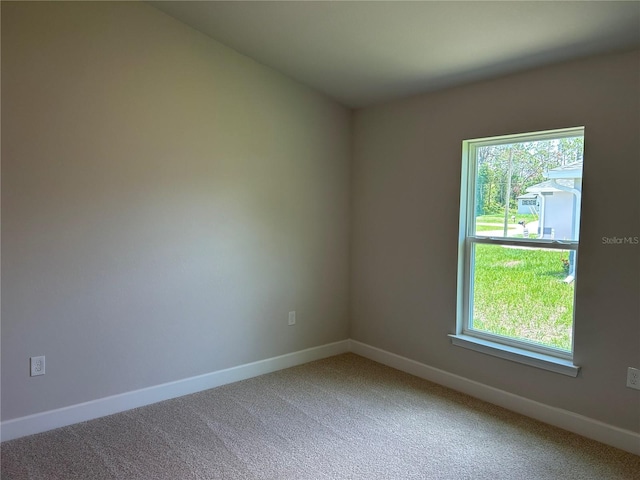 5661 Gaffney Rd, North Port, FL 34286 - unfurnished room with light colored carpet and baseboards