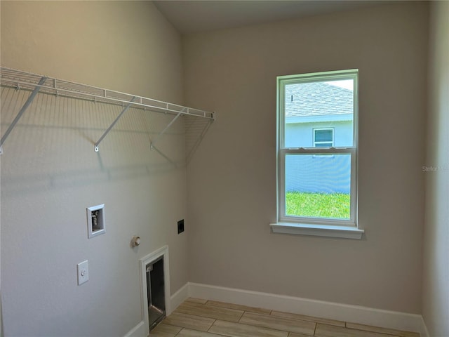 5661 Gaffney Rd, North Port, FL 34286 - washroom featuring hookup for an electric dryer, healthy amount of natural light, gas dryer hookup, and hookup for a washing machine