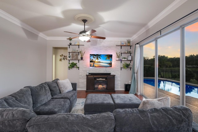 living room featuring ceiling fan, crown molding, and hardwood / wood-style floors