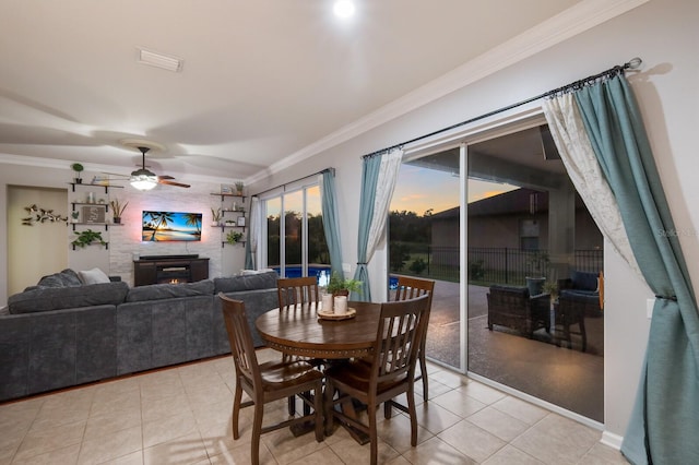 dining space featuring ornamental molding, light tile patterned floors, and ceiling fan