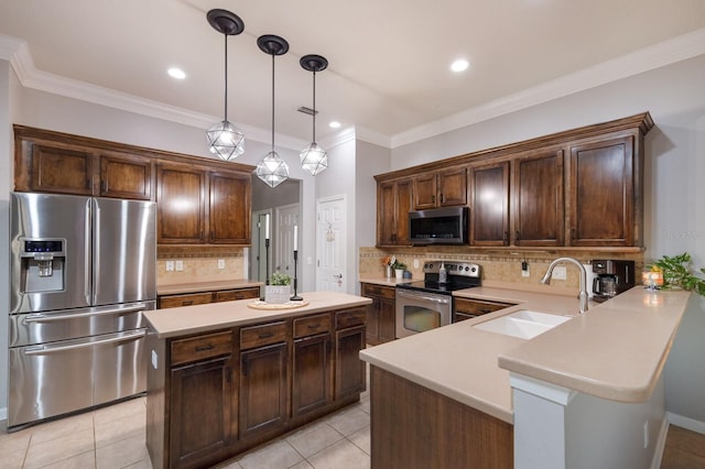 kitchen with sink, appliances with stainless steel finishes, decorative backsplash, and kitchen peninsula