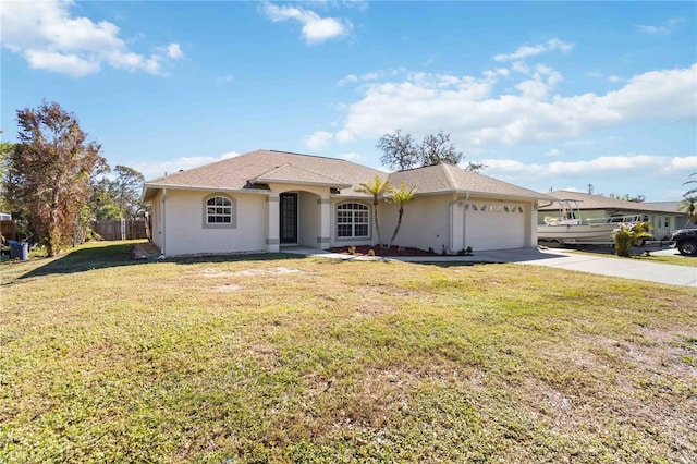 view of front of house featuring a garage and a front yard