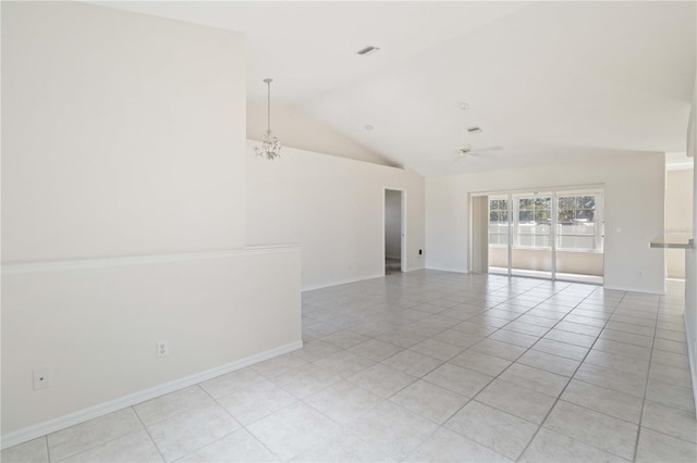 tiled empty room with ceiling fan with notable chandelier and high vaulted ceiling