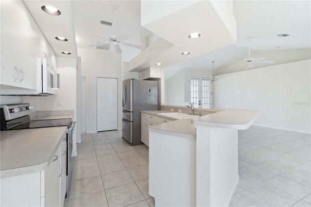 kitchen with white cabinets, ceiling fan, sink, and stainless steel appliances