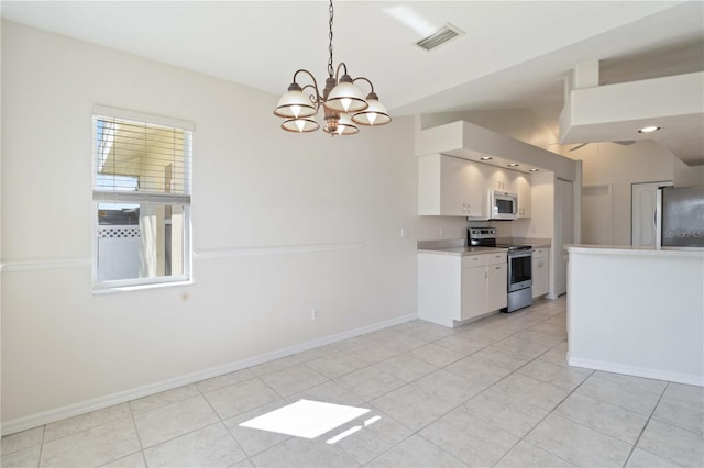 kitchen with pendant lighting, lofted ceiling, a notable chandelier, white cabinetry, and stainless steel appliances