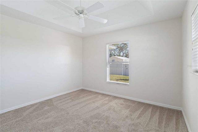 spare room featuring carpet and ceiling fan