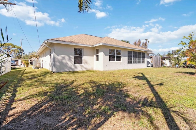 back of house with a yard