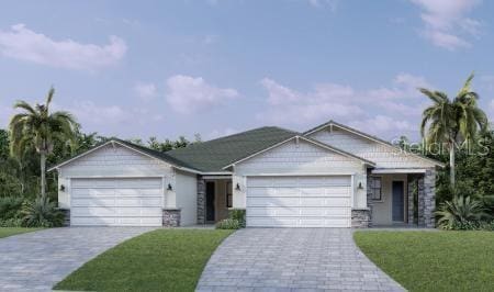 single story home with a garage and a front yard