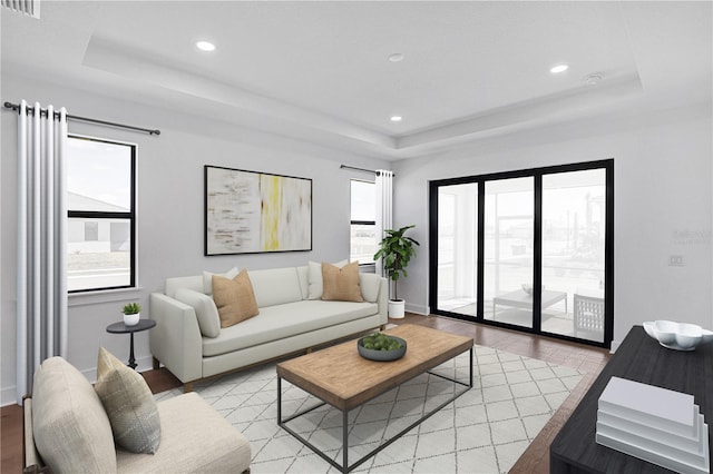 18824 Dayspring Pl, Venice, FL 34293 - living area featuring a tray ceiling, recessed lighting, baseboards, and light wood-style flooring