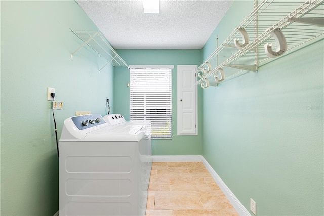 washroom with independent washer and dryer