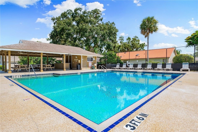 view of swimming pool featuring a patio area