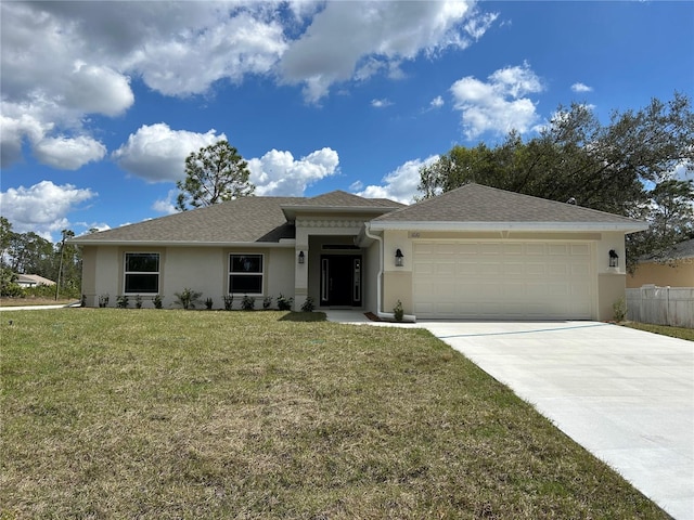 view of front of house featuring a garage, stucco siding, concrete driveway, and a front yard