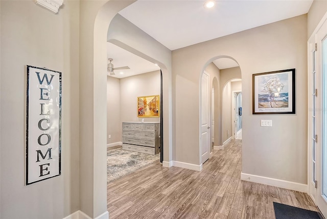 corridor with light hardwood / wood-style flooring