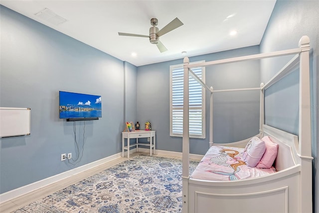 bedroom featuring hardwood / wood-style flooring and ceiling fan