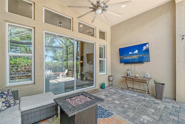 view of patio featuring a fire pit and ceiling fan