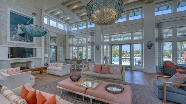 sunroom with french doors, beam ceiling, and coffered ceiling