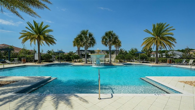 view of pool with pool water feature and a patio area