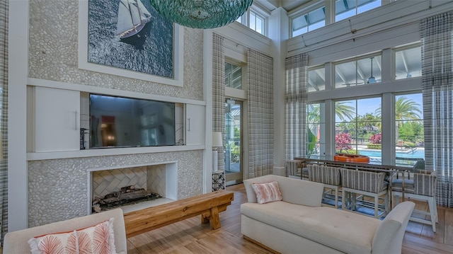 sunroom with a fireplace