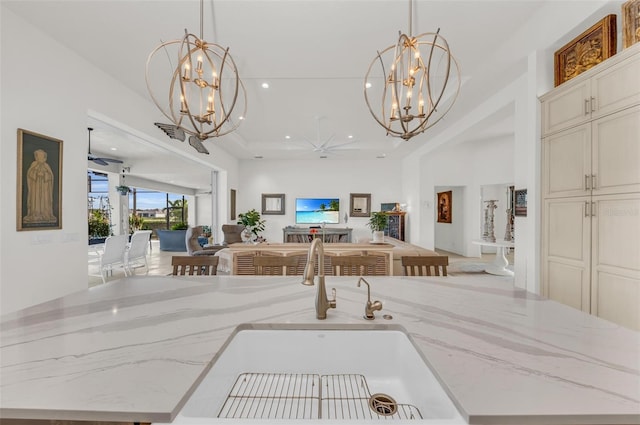 interior space with ceiling fan and sink