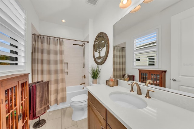 full bathroom with toilet, tile patterned floors, vanity, and shower / tub combo with curtain