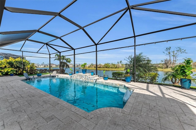 view of pool with a patio, glass enclosure, and a water view