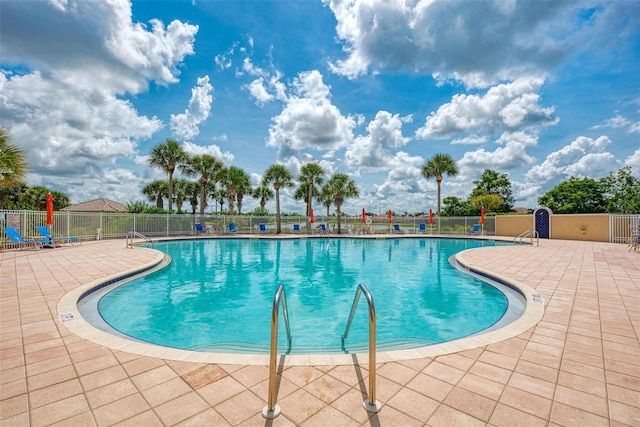 view of swimming pool featuring a patio area