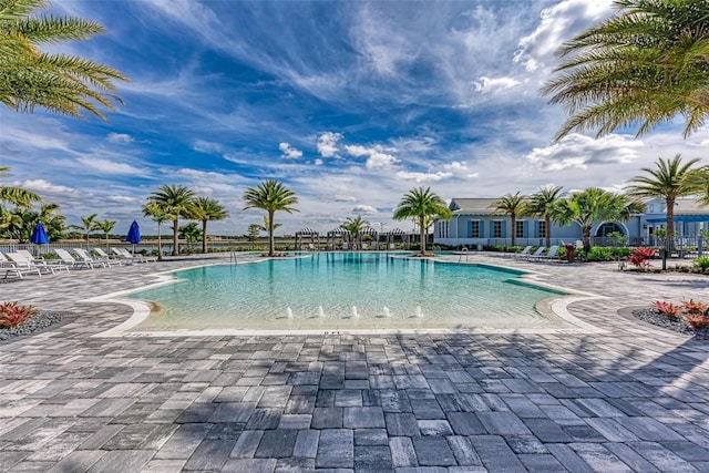 view of swimming pool featuring a patio area