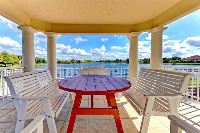 balcony with a water view and a patio