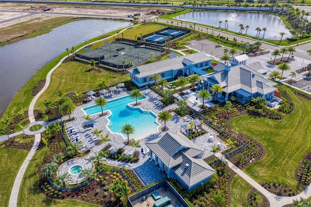 birds eye view of property with a water view