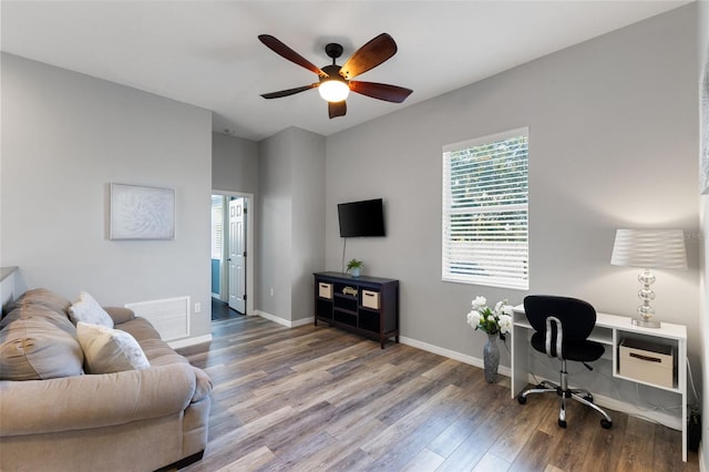 living room with hardwood / wood-style floors and ceiling fan