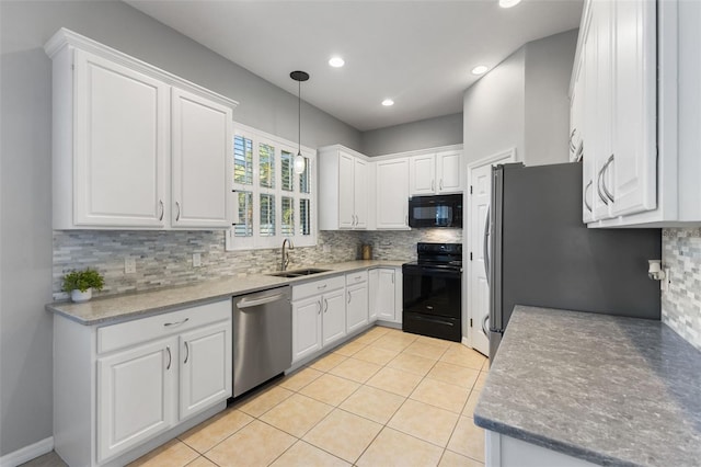 kitchen with backsplash, black appliances, white cabinets, sink, and decorative light fixtures