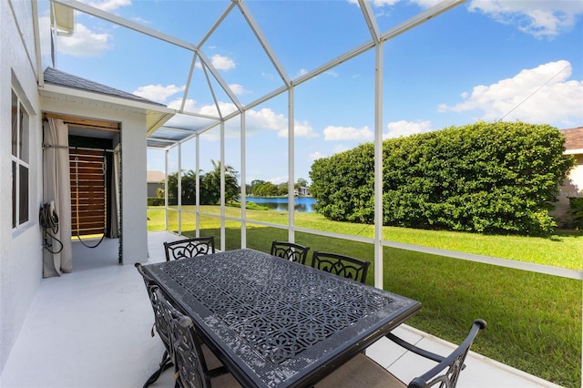 sunroom / solarium with a water view