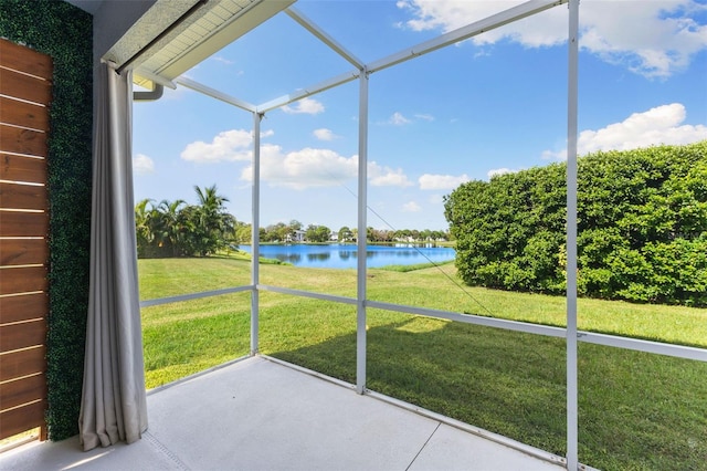 unfurnished sunroom with a water view