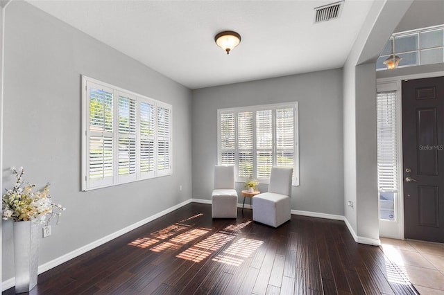 unfurnished room featuring dark wood-type flooring