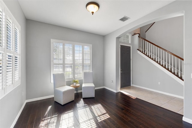 living area with hardwood / wood-style floors