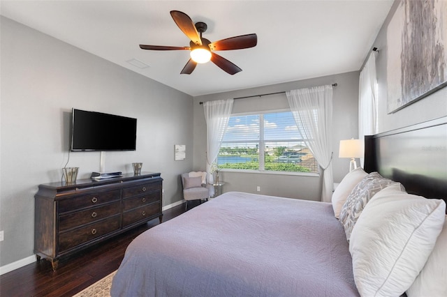 bedroom featuring dark hardwood / wood-style flooring and ceiling fan