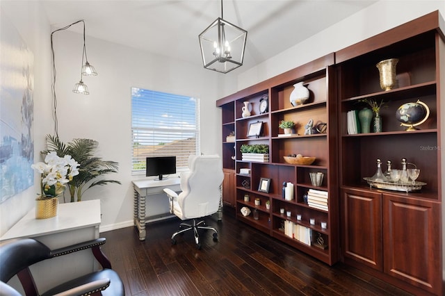 office area with dark wood-type flooring and a notable chandelier